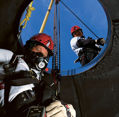 Confined Space complex rescue2 - Western Canada Fire & First Aid worker entering a confined space on breathing apparatus