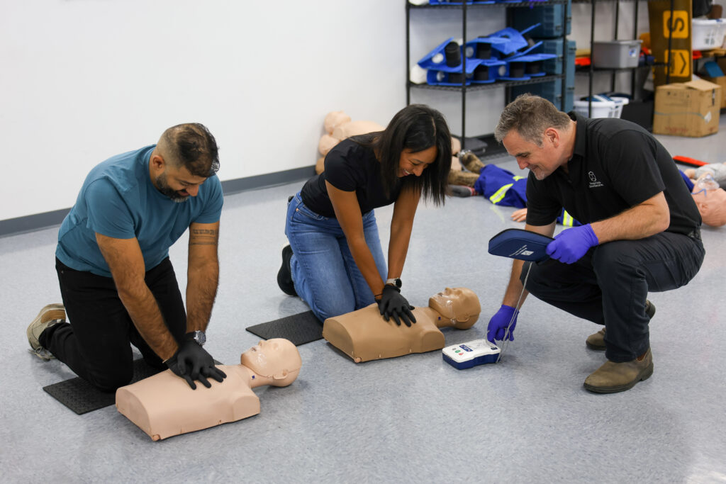 students performing CPR in a first aid class