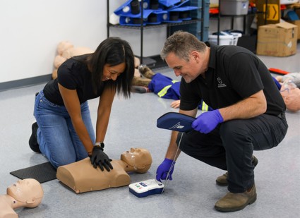 D68A5748-cropped - Western Canada Fire & First Aid students performing CPR in a first aid class