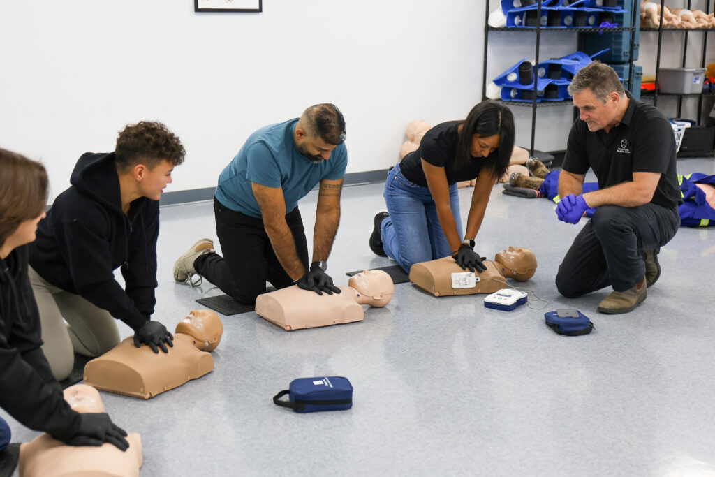 D68A5777 - Western Canada Fire & First Aid students learning in a first aid class
